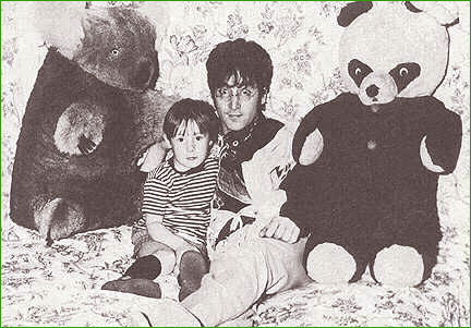 11: John Lennon and his son, Julian, strike a relaxing pose together amongst some of Julian’s oversized stuffed animals. This photo session took place in 1966 at John’s home in Kenwood, Weybridge, England.