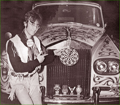 3: John Lennon shows off his psychedelic Rolls Royce at his home in Kenwood, Weybridge, England in 1966. By this time, John had taken to wearing the round-lensed glasses that became his ultimate trademark. John used the National Health style spectacles as part of his wardrobe for the film, How I Won the War, and continued to wear them afterward (with some exceptions) for the rest of his life.